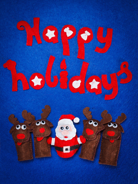 Christmas toys of Santa and reindeer with the words Happy Holiday - Foto, afbeelding