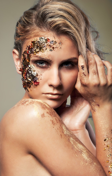 Vogue style portrait of a woman with gold makeup - Фото, зображення