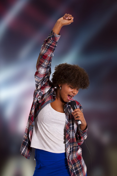 girl with microphone singing - Photo, Image