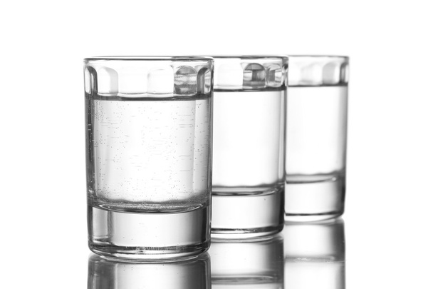 Three glass of vodka isolated on white - 写真・画像