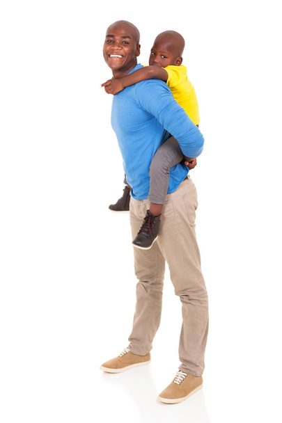 father giving son piggyback ride - Foto, Bild