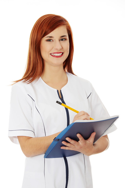 Smiling medical doctor or nurse. - Фото, изображение