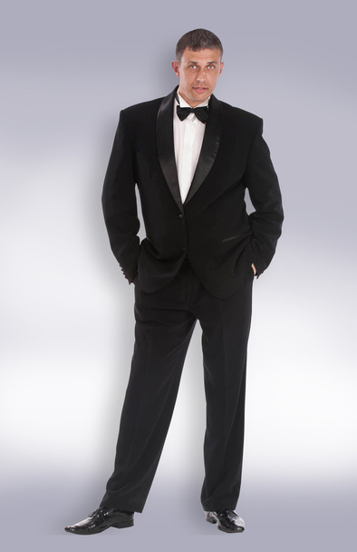 Caucasian adult man in classic tuxedo - 写真・画像