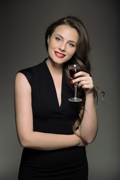 Business woman with glass red wine - Photo, Image