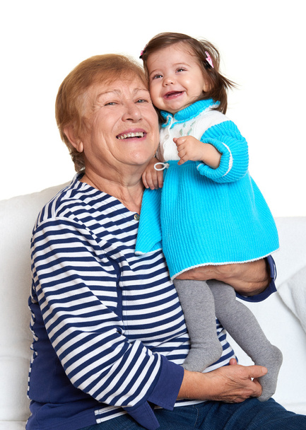 portrait of baby girl and grandmother on white, happy family concept - Photo, Image