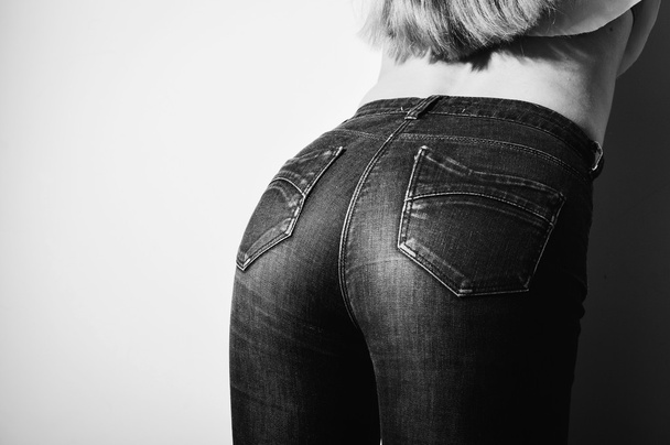 Black and white picture closeup of beautiful glamor female buttocks in jeans - 写真・画像