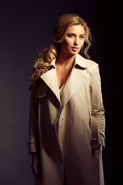sexy girl with long blond hair in beige fur coat - Foto, Imagen