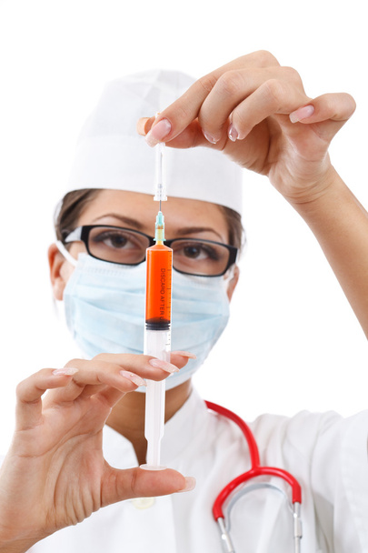 Young nurse in mask - 写真・画像