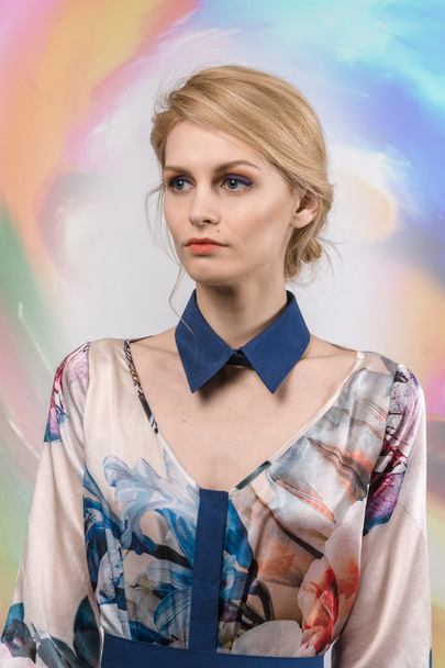 pretty girl in dress with collar posing in studio - Fotó, kép