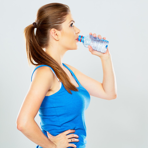 Woman with bottle of water - Foto, imagen