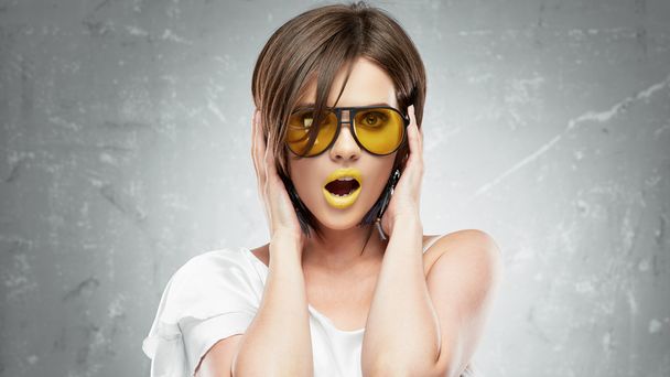 Model with yellow sunglasses - Фото, изображение