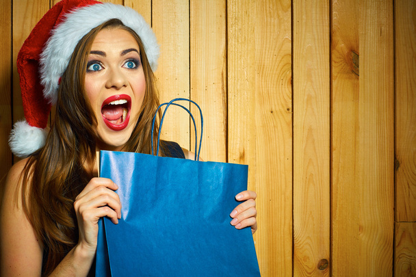 Santa girl holds shopping bag - Fotografie, Obrázek