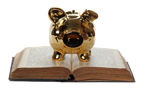 Livro velho com banco porquinho dourado
 - Foto, Imagem