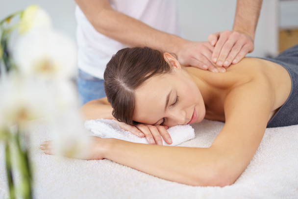 Woman Enjoying the Back Massage in Spa - Photo, image