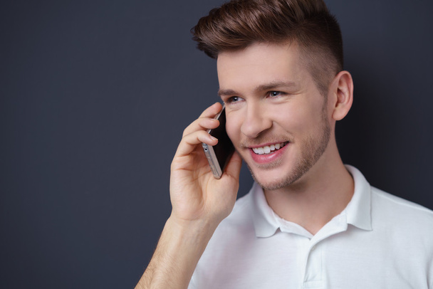young man talking on his mobile phone - Photo, Image