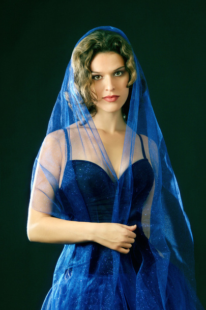Portrait of young beautiful woman in blue - Фото, изображение