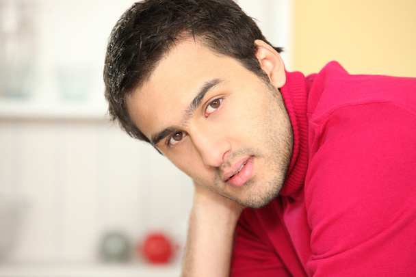 Man wearing red polo in kitchen - Foto, immagini