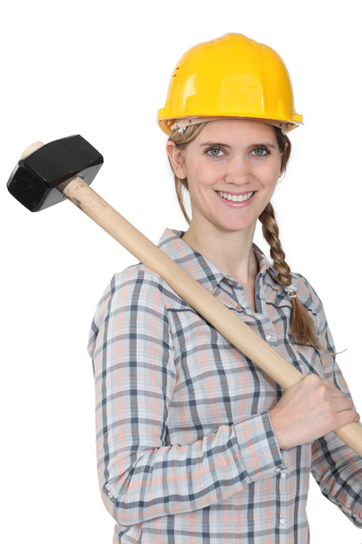 Woman with large hammer - 写真・画像