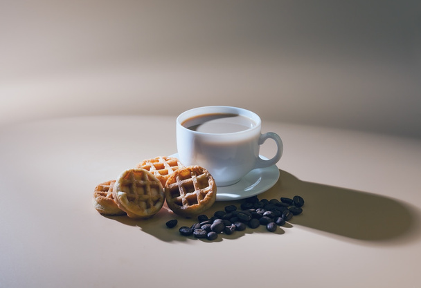 cup of coffee with milk and soft waffles. - Fotó, kép