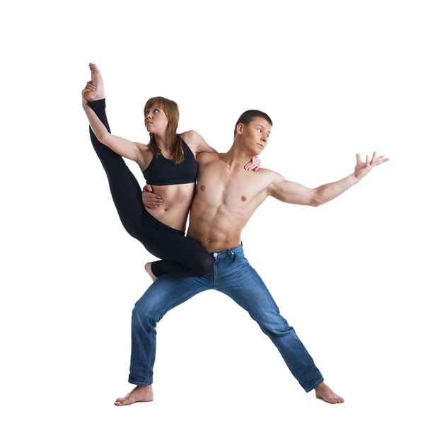 Two young gymnast show exercise isolated - Photo, image