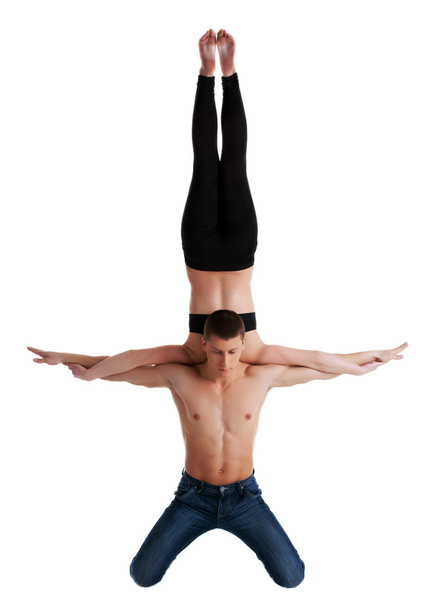 Two young acrobats perform high skill exercise - Foto, immagini