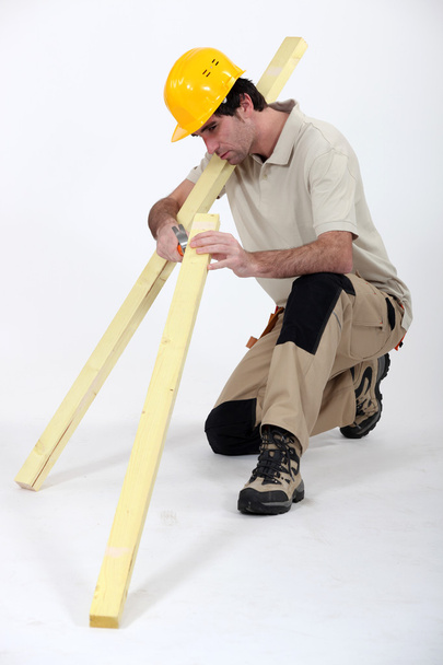 Carpenter with lumber at work - Fotografie, Obrázek