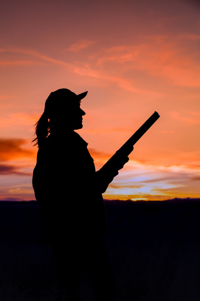 Hunter Silhouetted al tramonto
 - Foto, immagini