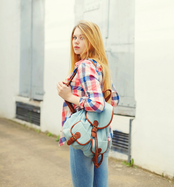 young girl wearing shirt with backpack outdoors in city - Foto, Imagem