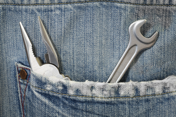 Jeans com ferramentas
 - Foto, Imagem