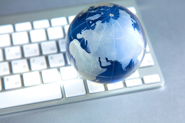 Cristal globe of the Earth on a Computer - Photo, Image