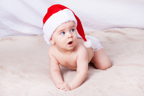 Beautiful little baby celebrates Christmas.  - Фото, изображение