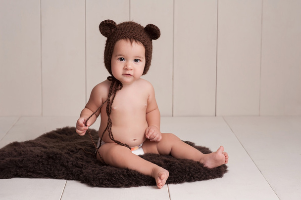 Baby Wearing a Bear Bonnet - Photo, Image