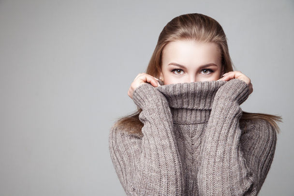 Beautiful blond young girl wears winter pullover - Foto, immagini