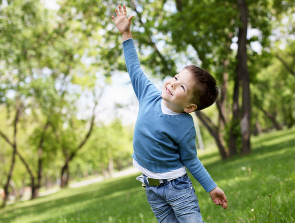 Portrait of a little boy outdoors - Fotó, kép