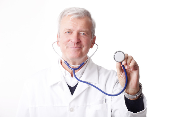 doctor holding a stethoscope up - 写真・画像