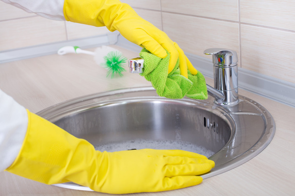 Cleaning kitchen sink and faucet - Photo, Image