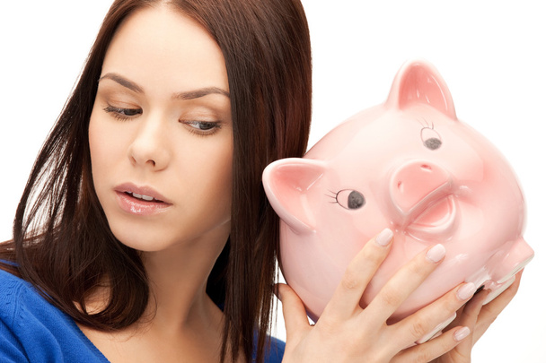 Lovely woman with piggy bank - Photo, Image