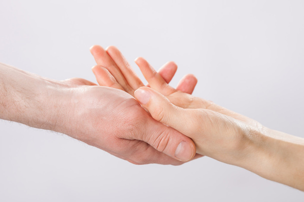  Man's hand gently holding woman's hand - Fotografie, Obrázek
