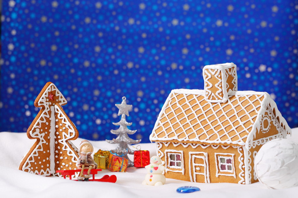 Christmas card with gingerbread house and tree - Фото, изображение
