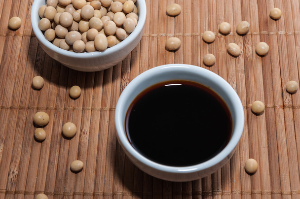 Soy sauce on a tablecloth - Foto, afbeelding