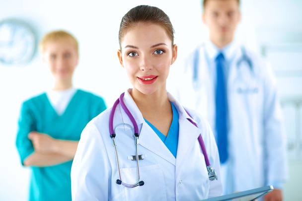 Woman doctor standing with stethoscope at hospital - Zdjęcie, obraz