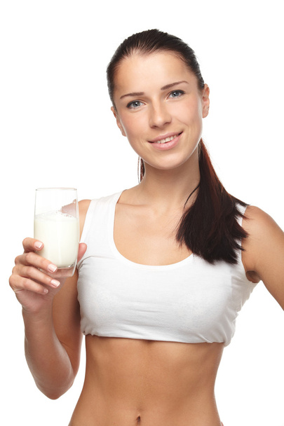 Young woman with glass of milk - Photo, Image
