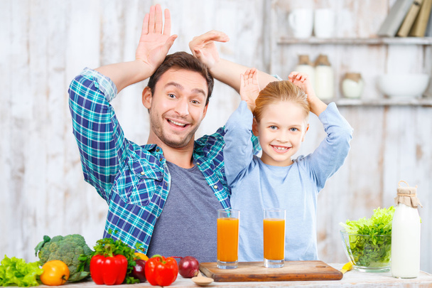 Happy father and daughter cooking together - Photo, image