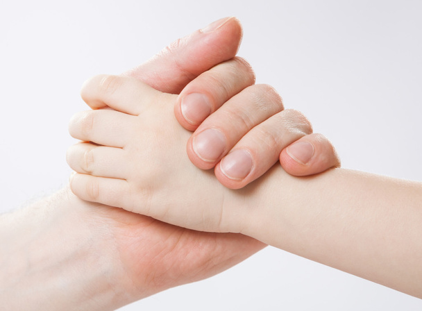 Hands of a child and a father - Foto, Bild