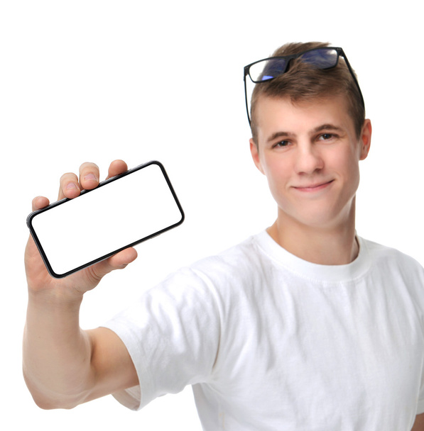 Happy young man show display of mobile cell phone with blank scr - Фото, изображение