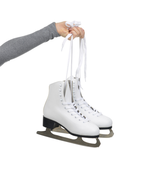 Hand with thumb up sign holding woman ice skates - Foto, Imagem