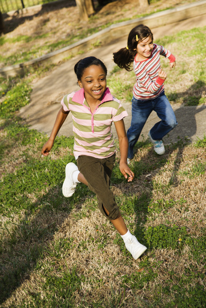 Young Girls Running on Grass - Фото, изображение