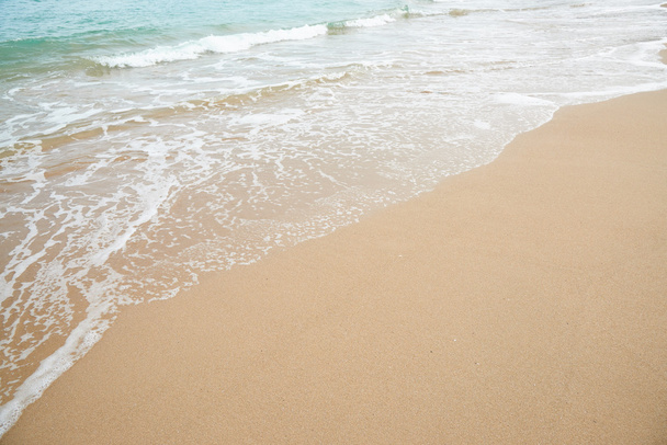 Closeup of sandy beach with sea water in Songjeong, Busan, Korea. - Photo, Image