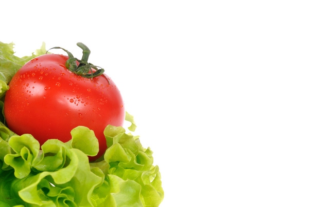 Red tomato with green salad - Фото, зображення