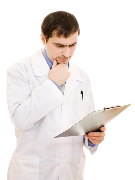Male doctor thinks a white background. - Foto, Imagen